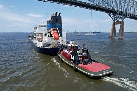 The Kayee Moran pushes The Amigo underneath the Key Bridge on June 16, 2022.