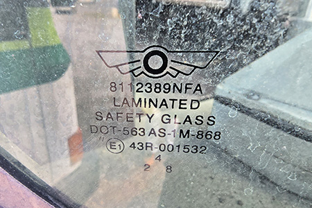 Boom.  OEM windshield still in place, with the New Flyer part number right on the glass.