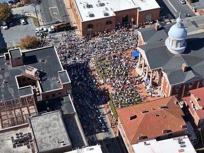 After I parked the car, the first thing that I did was to send my drone up around the event just to get a feel for the size of things.  For safety, I did a wide arc around the event, keeping the drone about a block and a half away from the edges of the event, and then I used the zoom lens to get a closer view.  This is where I realized that it was a much larger event than I had predicted.