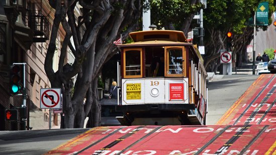 A cable car crosses the intersection of Powell and Bush Streets.  Surprisingly, I only photographed the cable cars, and never actually rode them.  I saw the lines to board, and I decided that I could pass on it.
