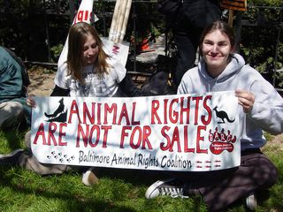 These people carried a banner regarding animal rights. The woman at left also wears a shirt regarding the treatment of circus animals.