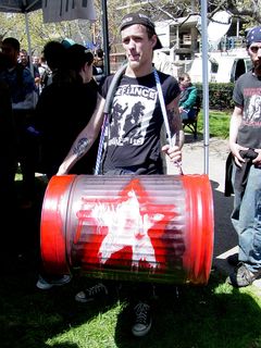 This gentleman decorated a trash can, and was using it as a giant drum.