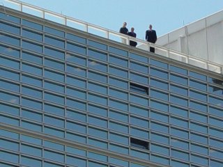 The group of people on the roof of the World Bank, watching the demonstration from above.