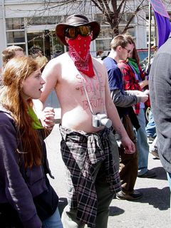 This gentleman wore a bandanna and ski goggles, with "STOP POLICE BRUTALITY" written on his chest in red marker.
