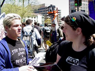 A gentleman approaches Sis asking for donations.