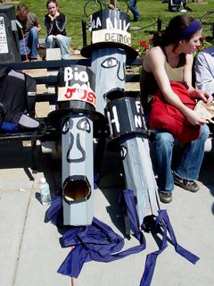 Some of the top hats were leaning against a bench, their purpose having been fulfilled.