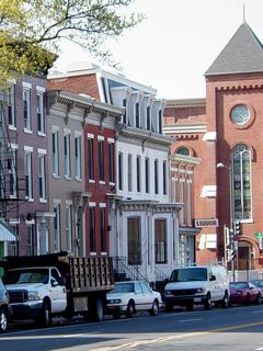 The Infoshop is very inconspicuous from the street. You really have to be looking for it in order to find it. It's located in the basement of the Arthur Flemming Center, which is that white building near the center of the photo.