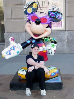 Sis poses with the Elton John-themed Mickey outside the Reagan Building.