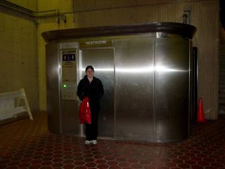 Sis poses with the Exeloo at Huntington.  This also marks another milestone in Sis's Metro experience.  She has now ridden the entire length of the Yellow Line, though not in one trip.