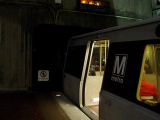 An eight-car train at Rosslyn.  You can tell it's eight cars by the fact that it's pulled all the way up to the tunnel portal.  Normally, four-car and six-car trains center themselves on the platform, leaving space at both ends.  Eight-car trains fill the entire length of the platform.