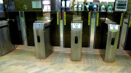 MBTA faregates. When opening after processing your CharlieCard or CharlieTicket, the gates move up and to the side to allow passage.