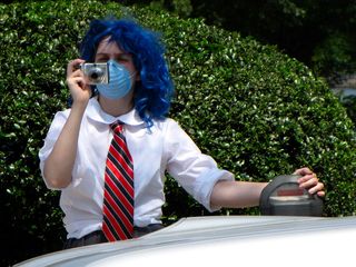 Blue Wig Girl gets a photo of the raid from a distance.