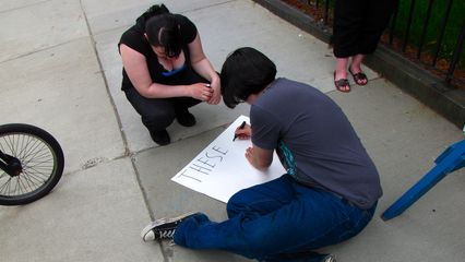 Pinstripe and Ron Jeremy work on a sign.