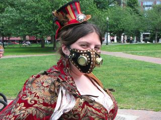 HT smiles (we'll take her word for it on that) for the camera in her steampunk hat and mask.