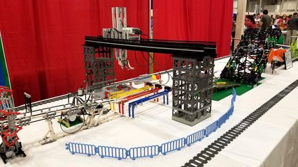 I saw a lot of animated displays at BrickFair.  This one, called Mindstorms Machines, took a ball through a course and then eventually loaded it onto a train, which brought it back to the start.  It reminded me of the Swiss Jolly Ball at the Museum of Science and Industry in Chicago.