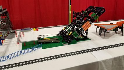 I saw a lot of animated displays at BrickFair.  This one, called Mindstorms Machines, took a ball through a course and then eventually loaded it onto a train, which brought it back to the start.  It reminded me of the Swiss Jolly Ball at the Museum of Science and Industry in Chicago.
