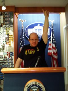 At the America! store at Union Station, they had a lectern set up like the White House press briefing room. And each of us decided to ham it up a little. I posed like I was giving an impassioned speech, and Mom did a Nixon-esque pose.