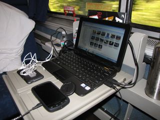 We kept my netbook out on the tray in the middle of the roomette the whole time except overnight. We did this in order to keep our electronic devices charged where we only had one electrical outlet. The computer was plugged into the outlet, and then my phone, Mom's phone, and Mom's iPod were each connected to the computer via USB.