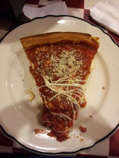 Back in Rogers Park, we went to Giordano's for some authentic Chicago-style deep dish pizza. It was awesome. If you've never tried it, you must do so the next time you're in Chicago. The top photo is one of my slices, and the bottom photo is the second half of the pizza after we each got a slice.