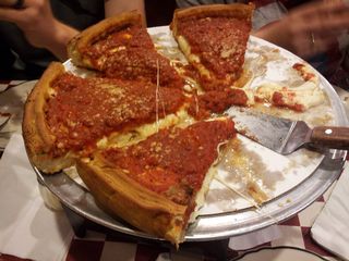 Back in Rogers Park, we went to Giordano's for some authentic Chicago-style deep dish pizza. It was awesome. If you've never tried it, you must do so the next time you're in Chicago. The top photo is one of my slices, and the bottom photo is the second half of the pizza after we each got a slice.