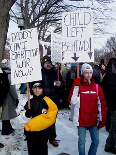 I particularly enjoyed the sign on the right in this photo. As my mother is a teacher, our family is strongly against "No Child Left Behind" as we find that the program contains some provisions that are beyond educators' control, leaving everyone behind as a result.