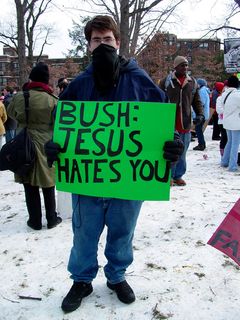 This masked group had some interesting signs, criticizing the Bush administration by invoking religious figures, nature, and oppressive regimes.