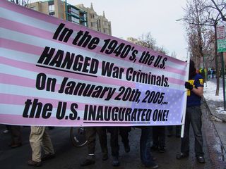 This banner, designed as an upside-down flag, which is generally viewed as a distress sign, indicates how times have changed since World War II...