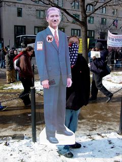 As has become a staple at many of these kinds of marches, likenesses of George W. Bush come out. This one showed Bush with a Hitler mustache, a substance that's supposed to resemble cocaine on his nose, and a big wad of cash penned into his hand.