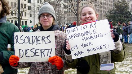 With double-sided signs, these people have a message, and they mean it!