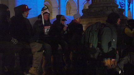 Quite a few people also sat along the retaining wall where our demonstration was being held.