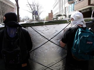 As seen here, our banner was more than just cloth, and was somewhat reinforced. With this in mind, the banner required extra handling, and if push possibly came to shove, the banner had a greater chance of being destroyed in a scuffle.