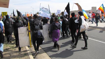 The march continues through the Pentagon's parking lots along Boundary Channel Drive.