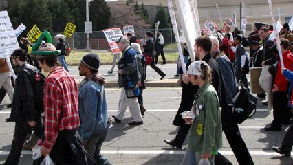 The march continues through the Pentagon's parking lots along Boundary Channel Drive.