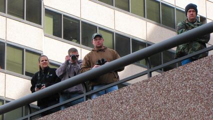 From a balcony along our march route, a number of non-participants took a moment to watch our march pass by.