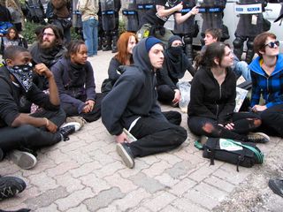After having been marching more or less continuously for more than eight miles, the group that had originally gathered for the black bloc leaving from Farragut Square finally got a chance to sit down and chill out for a while.