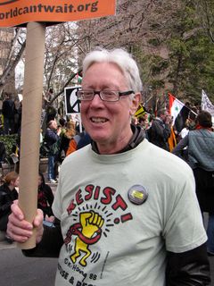 Former DAWN activist David Barrows, holding a World Can't Wait sign.