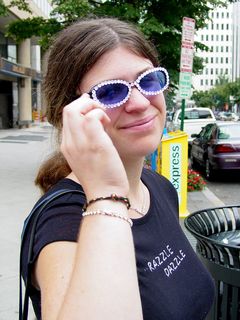 Our first target was Farragut Square in Northwest DC. Before crossing the street to the square itself, Sis showed off her rhinestone sunglasses. She actually made these herself, after seeing a similar pair in Charlottesville for $30. So she bought a cheap pair of sunglasses, some glue, and a bag of rhinestones. Total cost? $6. I'd say it's well worth it, don't you think? She did a really good job...
