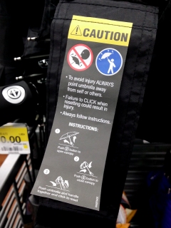 I had to replace my umbrella on April 14 after I lost my old one, and I was surprised to see this label on the new one. I always figured that it was a given that you shouldn't open the umbrella with the business end pointed towards you, but I guess not everyone knows that...