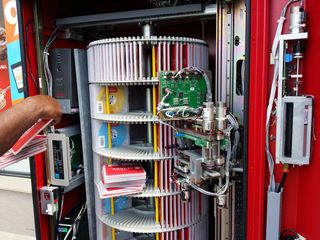 On May 20, I stopped at the 7-Eleven in Aspen Hill and spotted the Redbox movie rental kiosk open and being serviced. I suppose I never gave much thought to what the inside of a Redbox looked like prior to this, but this is what it looks like.