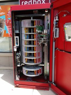 On May 20, I stopped at the 7-Eleven in Aspen Hill and spotted the Redbox movie rental kiosk open and being serviced. I suppose I never gave much thought to what the inside of a Redbox looked like prior to this, but this is what it looks like.