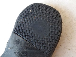 On a transit bus, much to the surprise of many who don't work in the industry, the turn signals are on the floor, operated with the left foot. This shoe, which I retired in June, shows a distinct wear pattern from signaling many, many turns.