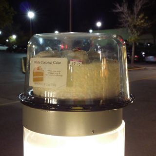 On October 12, I spotted a cake sitting abandoned on top of a light at Montgomery Mall in front of Cheesecake Factory. Bet someone set it down for a moment and then walked away, forgetting it.