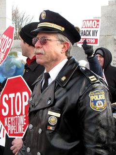 Captain Ray Lewis, in his police uniform, present at the Forward on Climate rally.