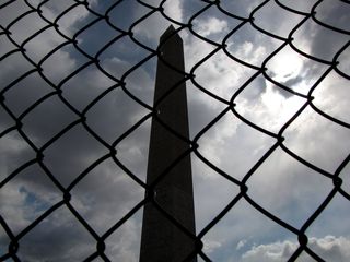 The Washington Monument was behind temporary fencing in preparation for a project that would repair damage sustained during the earthquake that occurred on August 23, 2011.