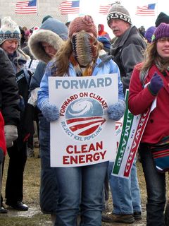 I would guess that this woman is likely masked as protection against the cold, i.e. if it were ten degrees warmer, she wouldn't be covered.