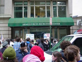 Arriving at the recruitment center, we found that pro-war counter-protesters were already demonstrating outside the recruitment center, and that police had lined up between the two groups.