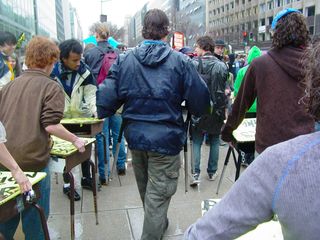 The desks come out, to be brought into position in the street.