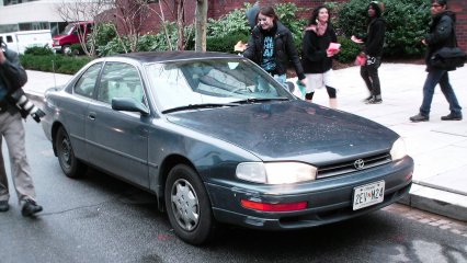 Handing a flyer to the driver of a car stopped by our march.