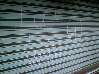 "F--- THE WAR" and a peace sign drawn in chalk on a garage door. The person who chalked this got scolded by the police, but not arrested.