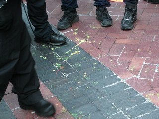 Yellow paint spattered on the sidewalk. I managed to catch a spot of this paint on my shoe, in fact.